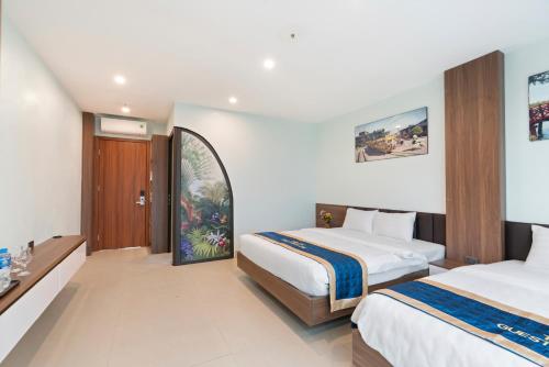 Ένα ή περισσότερα κρεβάτια σε δωμάτιο στο Tam Coc Guest House One & Hotel Ninh Binh