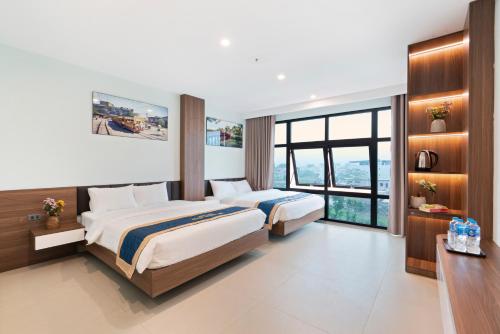 Ένα ή περισσότερα κρεβάτια σε δωμάτιο στο Tam Coc Guest House One & Hotel Ninh Binh