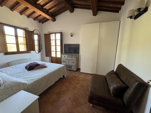 Ένα ή περισσότερα κρεβάτια σε δωμάτιο στο Borgo di Gaiole - Casa Julietta - apartment with a view & travel guide