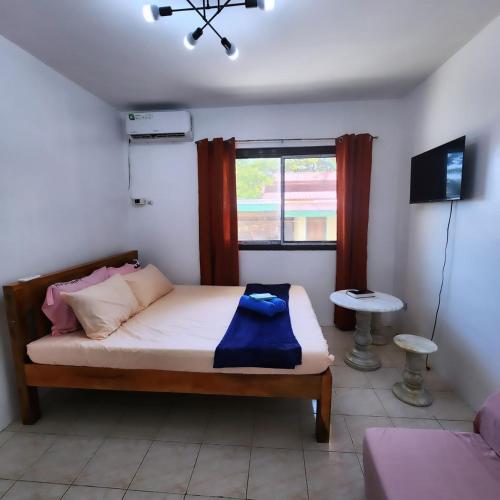 Postel nebo postele na pokoji v ubytování Pertible Beach Resort