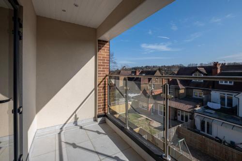 an apartment balcony with a view of a city at Luxury 5 Bedroom, 4 Bathroom Home in Purley in Purley