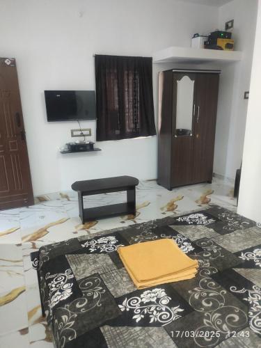 a room with a rug on the floor and a mirror at Coco farm in Pāmban