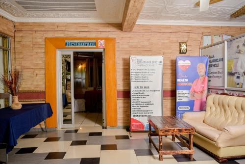 a store entrance with a table and chairs in a room at Crystal Palace Hotel in Gaborone
