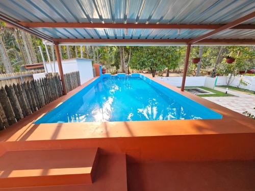 Bazén v ubytování Ibex Resorts, Coimbatore Kakarla nebo v jeho okolí