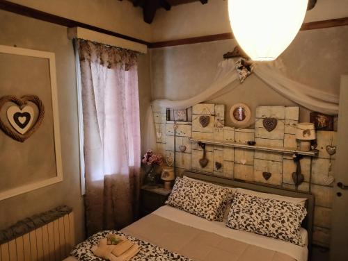 Postel nebo postele na pokoji v ubytování Piccola Casa Shabby 500m castello di Este
