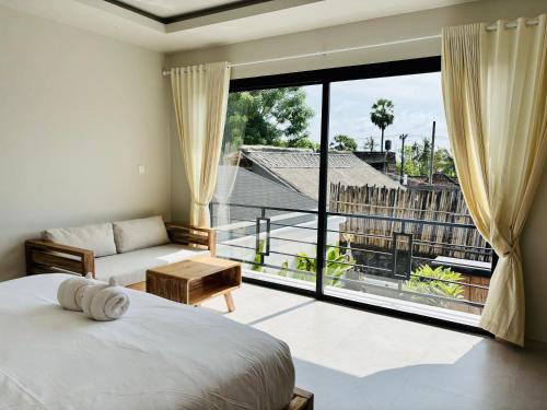 Ένα ή περισσότερα κρεβάτια σε δωμάτιο στο Lipah Beach Private Villas