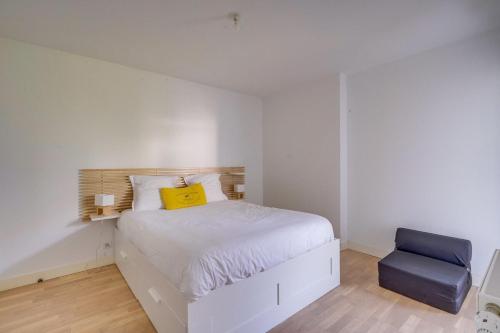 Ένα ή περισσότερα κρεβάτια σε δωμάτιο στο Appartement Dune-Arcachon centre