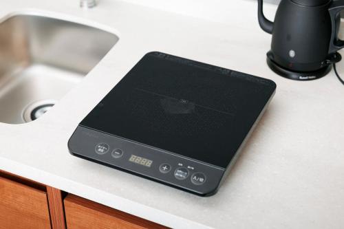 a tablet computer sitting on a counter next to a sink at Namba Oriental Hotel in Osaka