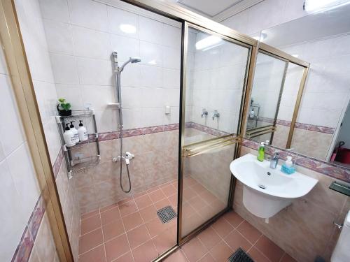 a bathroom with a shower and a sink at Like U Residence in Goyang