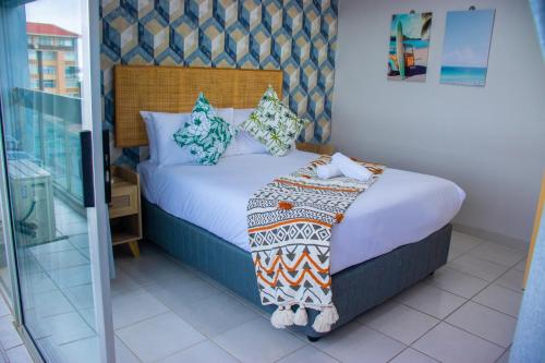 Katil atau katil-katil dalam bilik di Precious Paradise Beach Condo