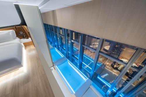 a view from the top of a cruise ship with a large window at 重庆Indition英迪逊高空酒店 解放碑来福士店 in Chongqing