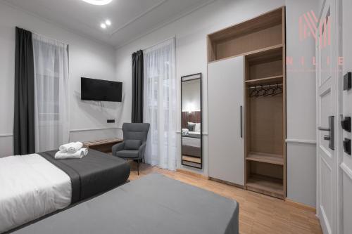 Katil atau katil-katil dalam bilik di Esther Suites, Nilie Hospitality MGMT