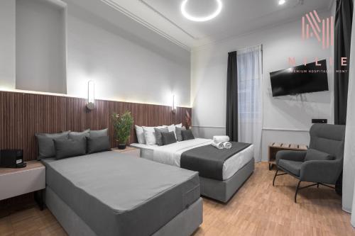 Katil atau katil-katil dalam bilik di Esther Suites, Nilie Hospitality MGMT