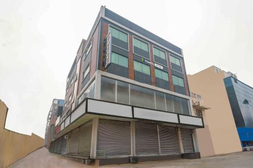 a tall building with a lot of windows at Treebo Gemstone in New Delhi