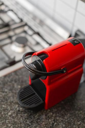 a red toaster sitting on top of a counter at Cherry Blossom in Ceres