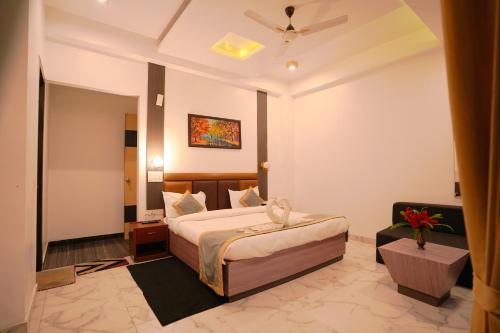a hotel room with a bed and a couch at Chirping Hills Resort,Bhimtal in Bhīm Tāl