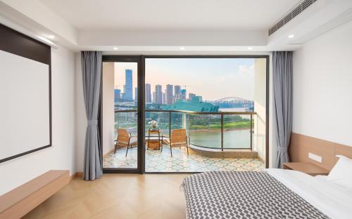 Katil atau katil-katil dalam bilik di 重庆暖余江景民宿 Chongqing Nuanyu River View Hotel