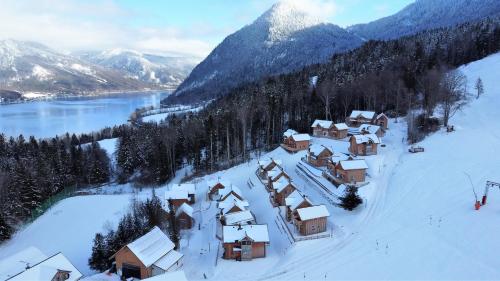 an aerial view of a village covered in snow at Narzissendorf Zloam Hotel in Grundlsee