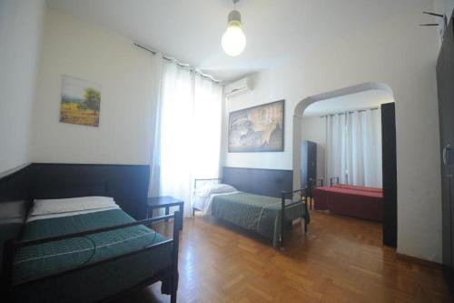 Postel nebo postele na pokoji v ubytování Backpackers Haven