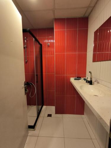 a bathroom with a shower and a sink at Akman City Hotel in Kusadası