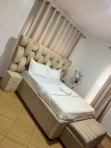 Ένα ή περισσότερα κρεβάτια σε δωμάτιο στο KOSUHOMEs