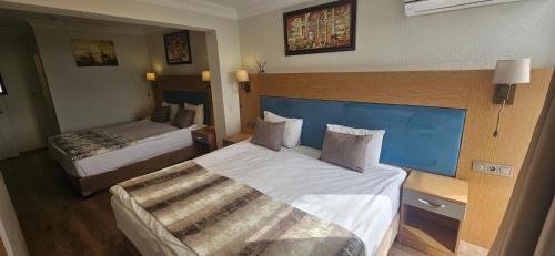 Ένα ή περισσότερα κρεβάτια σε δωμάτιο στο Seatanbul Hotel