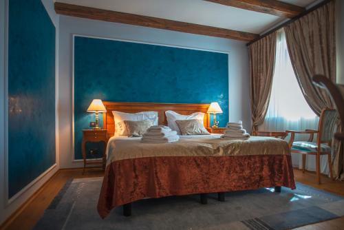 Postel nebo postele na pokoji v ubytování Hotel Dvorac Jurjevec