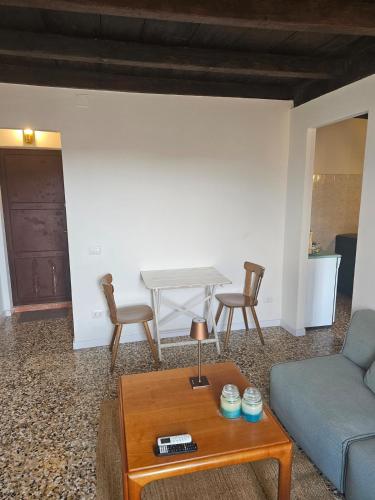 a living room with a couch and a table at Il Nido - Germignaga in Germignaga