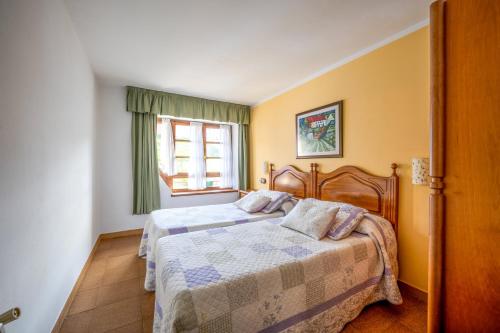 Postel nebo postele na pokoji v ubytování Alojamientos Casa Luisa