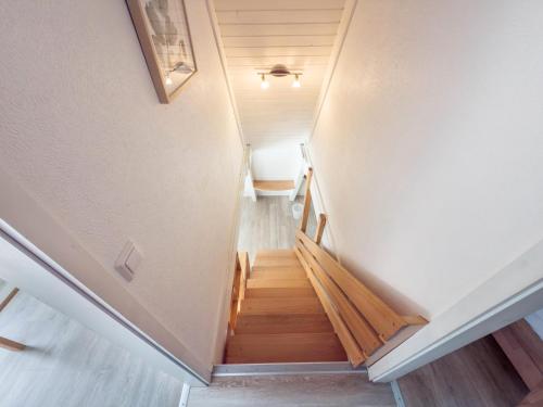 a staircase in a house with wooden floors at Wikinger 74 in Immenstaad am Bodensee