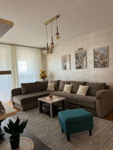 Coin salon dans l'établissement MANHATTAN APARTMAN Belvil