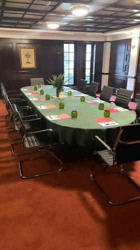 a conference room with a long table and chairs at Europa Gatwick Hotel & Spa in Crawley