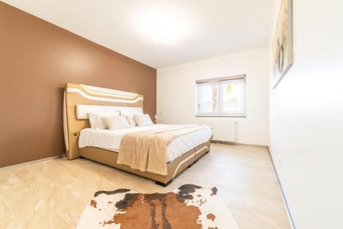 Una cama o camas en una habitación de Villa Geranios