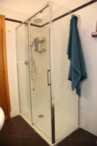 a shower with a glass door in a bathroom at RIO bed in Terni