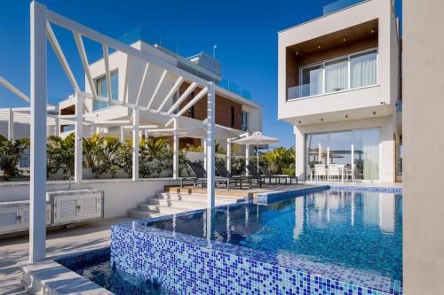 an image of a house with a swimming pool at Napa Hills Seaview Villas in Ayia Napa