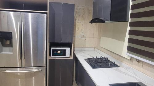 Kuchyň nebo kuchyňský kout v ubytování Bayview Apartment