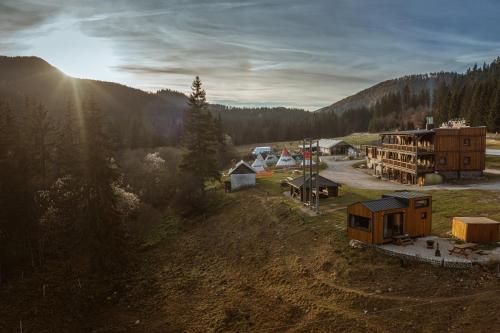 an aerial view of a resort with a building and trees at Ranč pod Ostrou Skalou in Stratená
