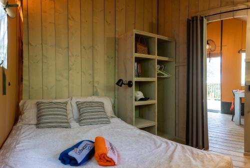 A bed or beds in a room at Casa Mobile - Cisano San Vito ****