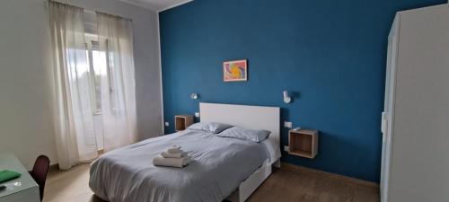Ένα ή περισσότερα κρεβάτια σε δωμάτιο στο A Casa di Marco