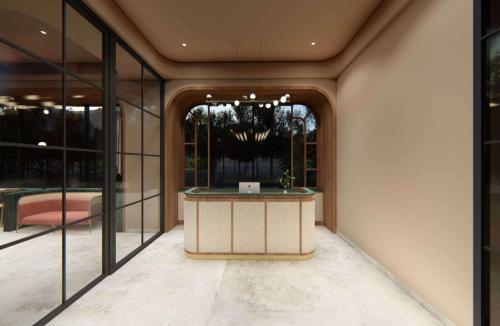 a lobby with a reception desk in a building at Gift City Club, a member of Radisson Individuals in Gandhinagar