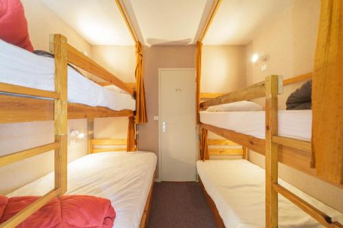 a bunk bed room with three bunk beds at Le Nid de Gourette - Au Pied des Pistes in Eaux-Bonnes