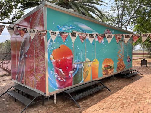 a food truck with a painting on the side of it at ATKV Buffelspoort in Rustenburg