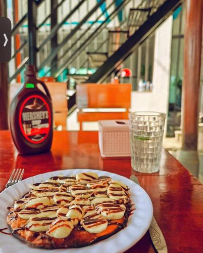 a pizza sitting on top of a table at Phong Nha Cherish House in Phong Nha