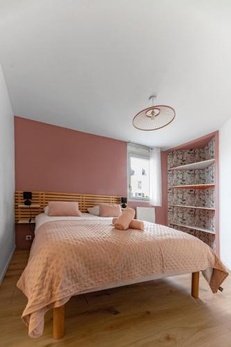 a bedroom with a large bed and a wine cellar at L'Alquié - Appartement design hyper centre in Vichy