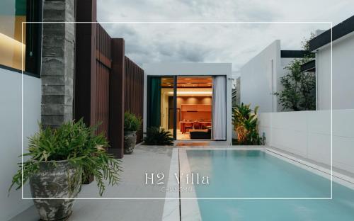 a swimming pool in the middle of a house at Casa Jasmine H2 l Private Pool 3BR Near Nimman in Chiang Mai
