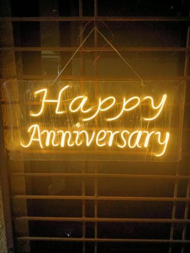 a sign in a window that says happy anniversary at Kalwars Millennials Park in Karjat