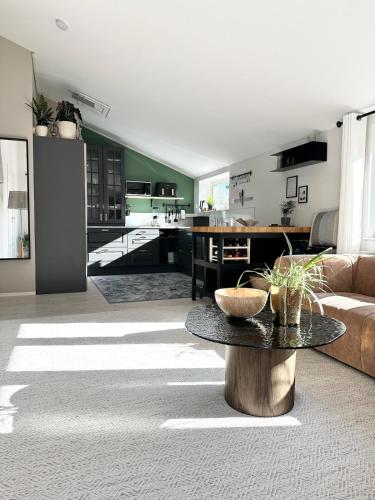 a living room with a couch and a table at Apartment close to central city in Gothenburg