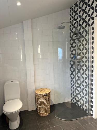 a bathroom with a toilet and a shower at Apartment close to central city in Gothenburg