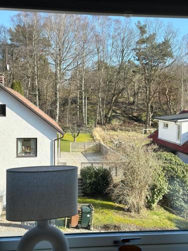 a window with a view of a yard at Apartment close to central city in Gothenburg