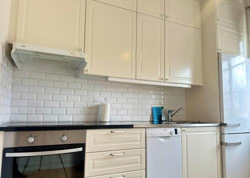 Kuchyň nebo kuchyňský kout v ubytování Stay Inn Söder Cozy apartment